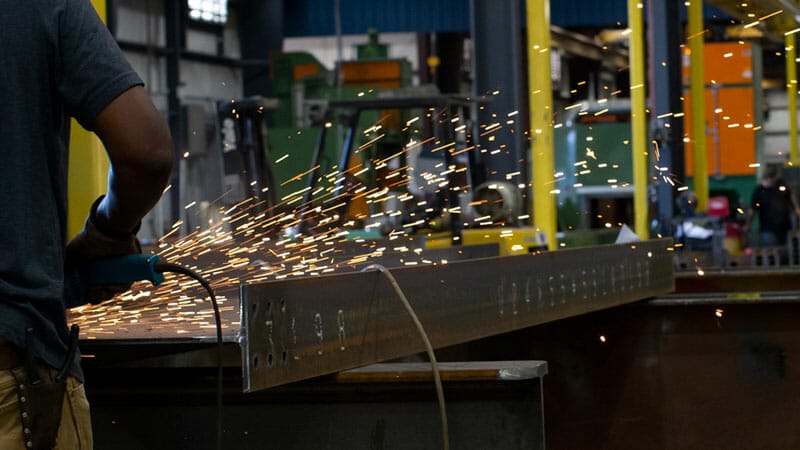 beam being prepped with a grinder