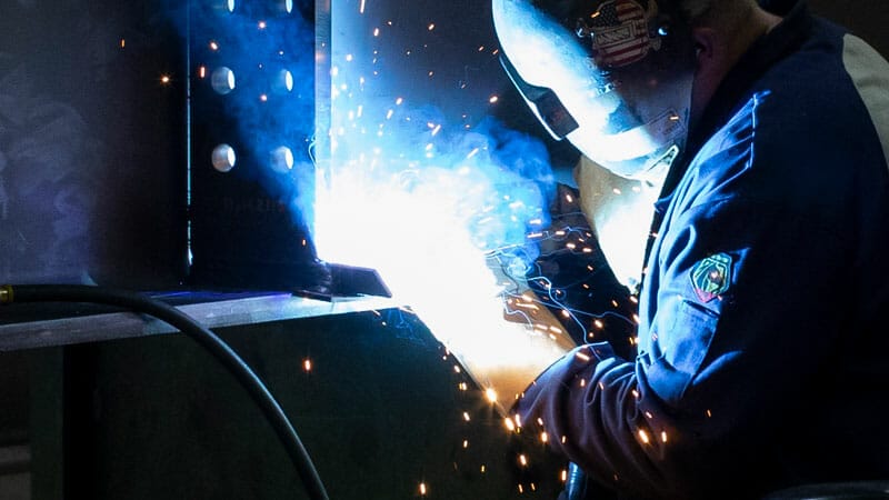 beam stiffener plate being welded to a beam